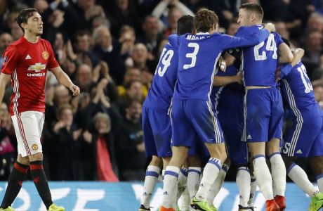 Chelsea players celebrate after scoring the opening goal during the English FA Cup quarterfinal soccer match between Chelsea and Manchester United at Stamford Bridge stadium in London, Monday, March 13, 2017. (AP Photo/Frank Augstein)