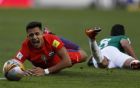 In this Tuesday, Sept. 5, 2017 photo, Chile's Alexis Sanchez left, grimaces after falling during a 2018 Russia World Cup qualifying soccer match against Bolivia at the Hernando Siles stadium in La Paz, Bolivia. (AP Photo/Juan Karita)