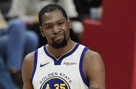 Golden State Warriors forward Kevin Durant, top, winks as guard Andre Iguodala during the second half in Game 6 of a first-round NBA basketball playoff series against the Los Angeles Clippers Friday, April 26, 2019, in Los Angeles. The Warriors won 129-110. (AP Photo/Mark J. Terrill)