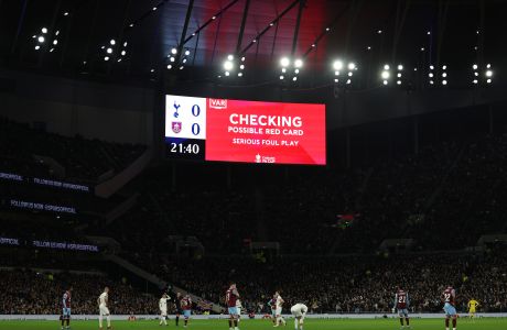 VAR checks a red card decision during the English FA Cup third round soccer match between Tottenham Hotspur and Burnley at the Tottenham Hotspur Stadium in London, Friday, Jan. 5, 2024. (AP Photo/Ian Walton)