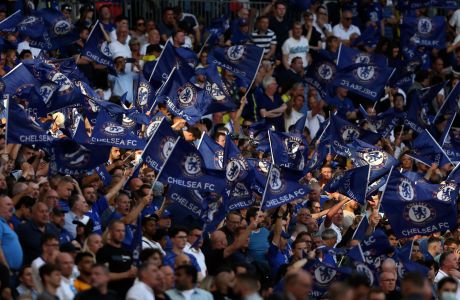 Chelsea fans wave flags during the English FA Cup final soccer match between Chelsea and Liverpool, at Wembley stadium, in London, Saturday, May 14, 2022. (AP Photo/Ian Walton)