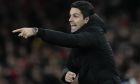 Arsenal's manager Mikel Arteta gestures during the English Premier League soccer match between Arsenal and Everton at the Emirates stadium in London, Wednesday, March 1, 2023. (AP Photo/Kirsty Wigglesworth)