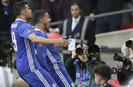 Chelsea's Eden Hazard, right, celebrates after scoring his side's third goal during the English FA Cup semifinal soccer match between Chelsea and Tottenham Hotspur at Wembley stadium in London, Saturday, April 22, 2017. (AP Photo/Tim Ireland)
