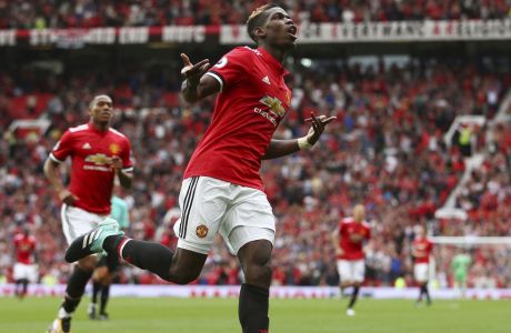 Manchester United's Paul Pogba celebrates scoring his side's fourth goal of the game during the English Premier League soccer match between Manchester United and West Ham United at Old Trafford in Manchester, England, Sunday, Aug. 13, 2017. (AP Photo/Dave Thompson)