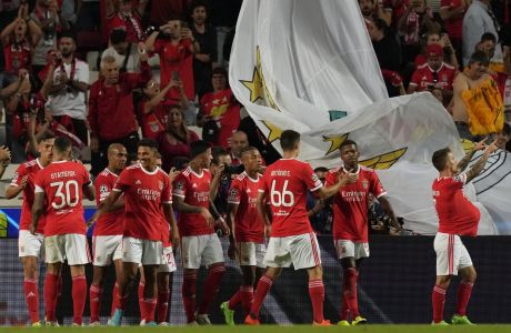 Benfica's Alex Grimaldo, right, celebrates after scoring his side's 2nd goal during the Champions League group H soccer match between Benfica and Maccabi Haifa at the Luz stadium in Lisbon, Tuesday, Sept. 6, 2022. (AP Photo/Armando Franca)