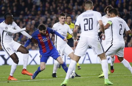Barcelona's Lionel Messi, center is surrounded by PSG players during the Champion's League round of 16, second leg soccer match between FC Barcelona and Paris Saint Germain at the Camp Nou stadium in Barcelona, Spain, Wednesday March 8, 2017. (AP Photo/Manu Fernandez)
