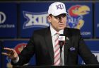FILE - In this Nov. 18, 2018, file photo, University of Kansas new NCAA college football coach Les Miles makes a statement during a news conference in Lawrence, Kan.  In his first season in charge, Miles is trying desperately to change the culture of Kansas football. He has pounded the pavement in recruiting, established relationships with influential boosters and generated newfound excitement in the Jayhawks. (AP Photo/Orlin Wagner, File)
