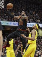 Cleveland Cavaliers' LeBron James (23) drives to the basket against Indiana Pacers' Myles Turner (33) in the first half of Game 7 of an NBA basketball first-round playoff series, Sunday, April 29, 2018, in Cleveland. (AP Photo/Tony Dejak)