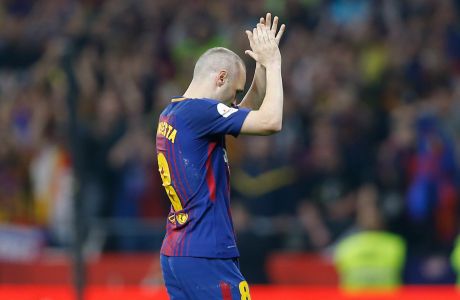 Barcelona's Andres Iniesta leave the pitch during the Copa del Rey final soccer match between Barcelona and Sevilla at the Wanda Metropolitano stadium in Madrid, Spain, Saturday, April 21, 2018. (AP Photo/Francisco Seco)