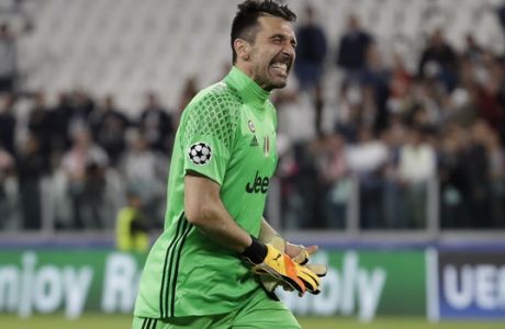 FILE - In this Tuesday, May 9, 2017 file photo, Juventus goalkeeper Gianluigi Buffon celebrates as he leaves the pitch after the Champions League semi final second leg soccer match between Juventus and Monaco in Turin, Italy. Juventus keeps on breaking records. And it set another one on Sunday when it clinched an unprecedented sixth successive Serie A title, with one game to spare, following a victory over Crotone. It is the first time since Serie A was founded in 1929 that a club has won six straight titles. (AP Photo/Luca Bruno, File)