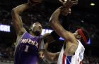 Phoenix Suns' Amar'e Stoudemire (1) goes up against Detroit Pistons' Rasheed Wallace in the first half of an NBA basketball game Sunday, Feb. 8, 2009, in Auburn Hills, Mich. (AP Photo/Duane Burleson)