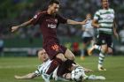 Barcelona's Lionel Messi, top, is challenged by Sporting's Jeremy Mathieu, during a Champions League, Group D soccer match between Sporting CP and FC Barcelona at the Alvalade stadium in Lisbon, Wednesday Sept. 27, 2017. (AP Photo/Armando Franca)