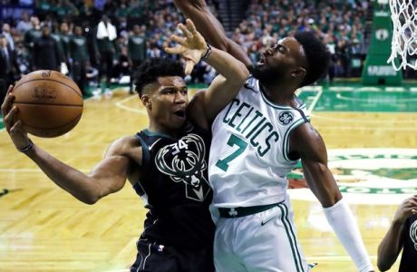 Boston Celtics guard Jaylen Brown (7) pressures Milwaukee Bucks forward Giannis Antetokounmpo, left, who looks to pass the ball during the second half of Game 5 of an NBA basketball first-round playoff series in Boston, Tuesday, April 24, 2018. The Celtics won 92-87. (AP Photo/Charles Krupa)