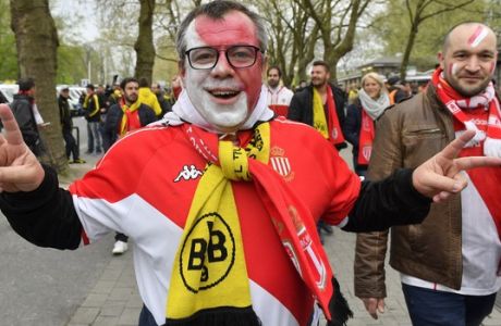 A Monaco supporters gestures prior the Champions League first leg quarterfinal soccer match between Borussia Dortmund and AS Monaco in Dortmund, Germany, Wednesday, April 12, 2017. (AP Photo/Martin Meissner)