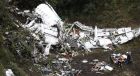 Rescue workers recover a body from the wreckage site of an airplane crash, in La Union, a mountainous area near Medellin, Colombia, Tuesday, Nov. 29, 2016. The plane was carrying the Brazilian first division soccer club Chapecoense team that was on it's way for a Copa Sudamericana final match against Colombia's Atletico Nacional. (AP Photo/Fernando Vergara)