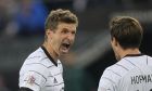 Germany's Thomas Muller, left, celebrates with Jonas Hofmann after scoring his side's third goal during the UEFA Nations League soccer match between Germany and Italy at Borussia Park in Monchengladbach, Germany, Tuesday, June 14, 2022. (AP Photo/Martin Meissner)
