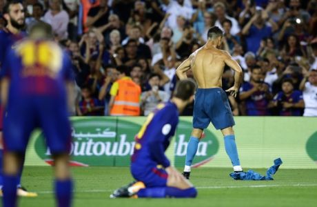 Real Madrid's Cristiano Ronaldo, right back, celebrates after scoring during the Spanish Supercup, first leg, soccer match between FC Barcelona and Real Madrid at the Camp Nou stadium in Barcelona, Spain, Sunday, Aug. 13, 2017. (AP Photo/Manu Fernandez)