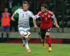 Albania's Ermir Lenjani (R) and Denmark's Peter Ankersen fight for the ball during their Euro 2016 qualifying soccer match at Elbasan arena stadium in city of Elbasan October 11, 2014.  REUTERS/Arben Celi 