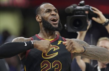 Cleveland Cavaliers' LeBron James celebrates after scoring the game-winning shot in the second half of Game 5 of an NBA basketball first-round playoff series against the Indiana Pacers, Wednesday, April 25, 2018, in Cleveland. The Cavaliers won 98-95. (AP Photo/Tony Dejak)