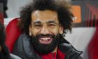 Liverpool's Mohamed Salah sits on the bench before the Europa League Group E soccer match between Liverpool and Toulouse, at Anfield in Liverpool, England, Thursday, Oct. 26, 2023. (AP Photo/Jon Super)