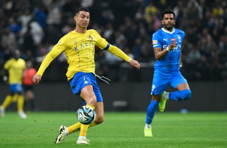 Al Nassr's Cristiano Ronaldo kicks the ball during Riyadh Season Cup 2024 final match against Al Hilal at Kingdom Arena Stadium in Riyadh, Saudi Arabia, Thursday, Feb. 8, 2024. (AP Photo)