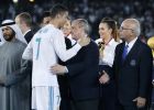Real Madrid's Cristiano Ronaldo greets Real Madrid President Florentino Perez, center, and Gremio President Romildo Bolzan Jr., right, after winning the Club World Cup final soccer match between Real Madrid and Gremio at Zayed Sports City stadium in Abu Dhabi, United Arab Emirates, Saturday, Dec. 16, 2017. (AP Photo/Hassan Ammar)