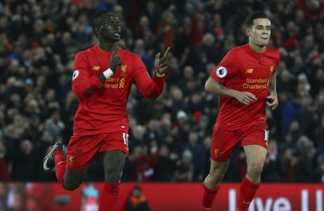 Liverpool's Sadio Mane, left, celebrates after he scores his sides 2nd goal of the game during the English Premier League soccer match between Liverpool and Arsenal at Anfield, in Liverpool, England, Saturday, March 4, 2017.(AP Photo/Dave Thompson)