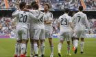 Real Madrid's Jese Rodriguez, second left, celebrates his goal with teammates during a Spanish La Liga soccer match between Real Madrid and Eibar at the Santiago Bernabeu stadium in Madrid, Spain, Saturday, April 11, 2015. (AP Photo/Andres Kudacki)