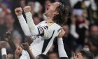Real Madrid's Luka Modric celebrates with his teammates after scoring his team's first goal during the Spanish La Liga soccer match between Real Madrid and Sevilla at the Santiago Bernabeu stadium in Madrid, Spain, Sunday, Feb. 25, 2024. (AP Photo/Manu Fernandez)