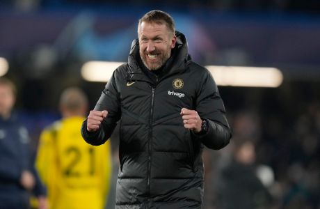 Chelsea's head coach Graham Potter celebrates after the end of the Champions League round of 16 second leg soccer match between Chelsea FC and Borussia Dortmund at Stamford Bridge, London, Tuesday March 7, 2023. (AP Photo/Alastair Grant)