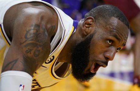 Los Angeles Lakers forward LeBron James reacts after scoring against the Cleveland Cavaliers during the first half of an NBA basketball game Sunday, Nov. 6, 2022, in Los Angeles. (AP Photo/Marcio Jose Sanchez)