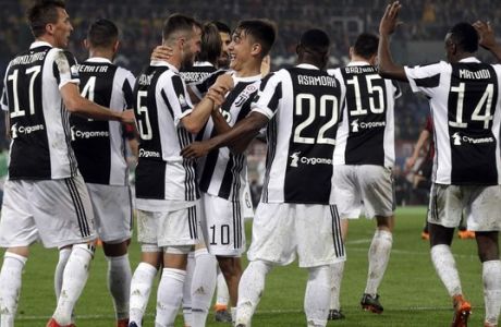Juventus players celebrate their side's 4th goal, during the Italian Cup final soccer match between Juventus and AC Milan, at the Rome Olympic stadium, Wednesday, May 9, 2018. (AP Photo/Gregorio Borgia)