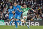 Betis' Alex Moreno, right, vies for the ball with Zenit's Artem Dzyuba during the Europa League play off, second leg soccer match between Betis and Zenit at the Benito Villamarin stadium in Seville, Spain, Thursday, Feb. 24, 2022. (AP Photo/Miguel Morenatti)