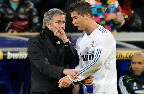 Real Madrid's Portuguese coach Jose Mour...Real Madrid's Portuguese coach Jose Mourinho (L) gives instructions to Real Madrid's Portuguese forward Cristiano Ronaldo (R) during the Spanish league football match Real Madrid CF vs Villarreal CF on January 9, 2011 at Santiago Bernabeu stadium in Madrid.  Real Madrid won 4-2. AFP PHOTO/ PEDRO ARMESTRE (Photo credit should read PEDRO ARMESTRE/AFP/Getty Images)
