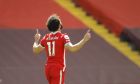 Liverpool's Mohamed Salah celebrates after scoring his side's opening goal during the English Premier League soccer match between Liverpool and Newcastle United at Anfield stadium in Liverpool, England, Saturday, April 24, 2021. (David Klein, Pool via AP)
