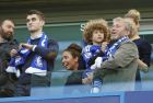 Chelsea owner Roman Abramovich smiles as he holds his son Aaron as his other son  Arkadiy looks on at left after the English Premier League soccer match between Chelsea and Crystal Palace at Stamford Bridge stadium in London, Sunday, May 3, 2015.  Chelsea won the match 1-0 to secure Premier League title with 3 games to spare. (AP Photo/Alastair Grant)