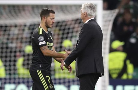 Real Madrid's head coach Carlo Ancelotti, right, shakes hands with Real Madrid's Eden Hazard after the Champions League Group F soccer match between Celtic and Real Madrid at Celtic park, Glasgow, Scotland, Tuesday, Sept. 6, 2022. (AP Photo/Scott Heppell)