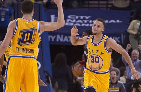 November 17, 2015; Oakland, CA, USA; Golden State Warriors guard Stephen Curry (30) celebrates with guard Klay Thompson (11) during the second quarter against the Toronto Raptors at Oracle Arena. Mandatory Credit: Kyle Terada-USA TODAY Sports