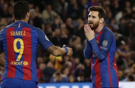 Barcelona's Luis Suarez, left, and Barcelona's Lionel Messi react after a missed chance to score during the Champions League quarterfinal second leg soccer match between Barcelona and Juventus at Camp Nou stadium in Barcelona, Spain, Wednesday, April 19, 2017. (AP Photo/Emilio Morenatti)