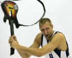 Dallas Mavericks forward Dirk Nowitzki swings a guitar around as he poses for a photo during the NBA basketball team's media day in Dallas, Monday, Sept. 29, 2008. (AP Photo/Donna McWilliam)