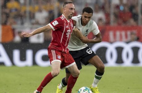 Bayern Munich's Franck Ribery, left, and Liverpool's Trent Alexander-Arnold vie for the ball during the Audi Cup semifinal soccer match between FC Bayern Munich and Liverpool FC in the Allianz Arena in Munich, Germany, Tuesday, Aug. 1 2017. (Sven Hoppe/dpa via AP)