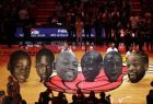 Cutout heads chronicling the career of Miami Heat guard Dwyane Wade sit on the court during a ceremony to honor Wade who is playing his final home regular season game when the Heat host the Philadelphia 76ers, Tuesday, April 9, 2019, in Miami. Wade is retiring at the end of the season. (AP Photo/Lynne Sladky)