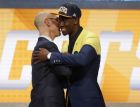 Caris LeVert, right, is greeted by NBA Commissioner Adam Silver after being selected 20th overall by the Indiana Pacers during the NBA basketball draft, Thursday, June 23, 2016, in New York. (AP Photo/Frank Franklin II) 