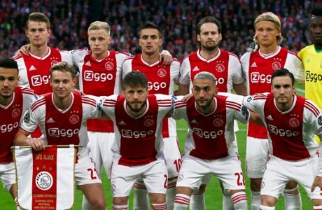 Ajax players pose before the Champions League semifinal second leg soccer match between Ajax and Tottenham Hotspur at the Johan Cruyff ArenA in Amsterdam, Netherlands, Wednesday, May 8, 2019. (AP Photo/Peter Dejong)