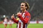 Atletico's Antoine Griezmann celebrates after scoring his side's second goal during the Champions League round of 16 first leg soccer match between Bayer Leverkusen and Atletico Madrid in Leverkusen, Germany, Tuesday, Feb. 21, 2017. (AP Photo/Martin Meissner)