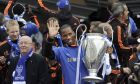 Chelsea football player Didier Drogba holds the Champions League trophy during a victory parade along the Kings Road in Chelsea, west London May 20, 2012.         REUTERS/Paul Hackett (BRITAIN - Tags: SPORT SOCCER)