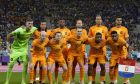 Netherlands players pose for a team photo prior the World Cup group A soccer match between Netherlands and Ecuador, at the Khalifa International Stadium in Doha, Qatar, Friday, Nov. 25, 2022. (AP Photo/Martin Meissner)
