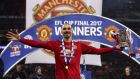 Manchester United's Zlatan Ibrahimovic celebrates with the trophy after his side won the League Cup Final soccer match by beating Southampton 3-2 at Wembley Stadium, London, Sunday Feb. 26, 2017. (Nick Potts/PA via AP)