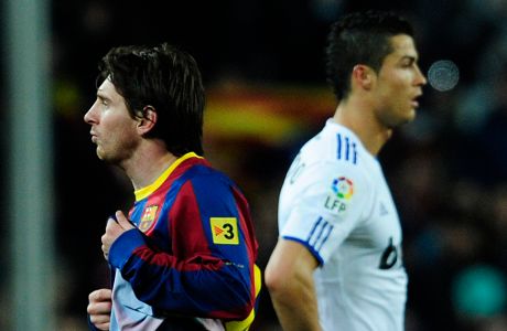 Real Madrid's Cristiano Ronaldo from Portugal, right, and FC Barcelona's Lionel Messi from Argentina, left, are seen during a Spanish La Liga soccer match at the Camp Nou stadium in Barcelona, Spain, Monday, Nov. 29, 2010. (AP Photo/Manu Fernandez)