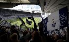 Fans wave flags ahead of the English Premier League soccer match between Tottenham Hotspur and Manchester United at White Hart Lane stadium in London, Sunday, May 14, 2017. It will be the last Spurs match at the old stadium, a new stadium is being built on the site. (AP Photo/Frank Augstein)